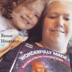 LaRee & Daughter of Broad Horizons with their copy of Wonderfully Made: God's Story of Life from Conception to Birth for kids from ages 5-11.